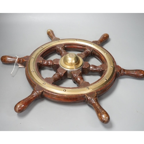 1414 - A hardwood and brass mounted Ship's wheel, signed Lawrence Simpson 50cm
