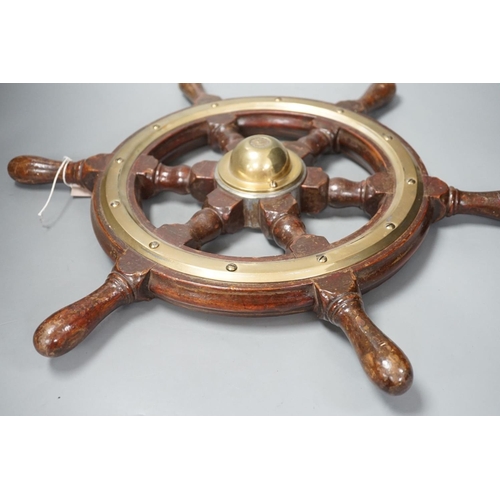 1414 - A hardwood and brass mounted Ship's wheel, signed Lawrence Simpson 50cm