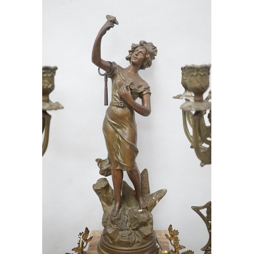 1417 - A French onyx and spelter figural clock garniture 66cm