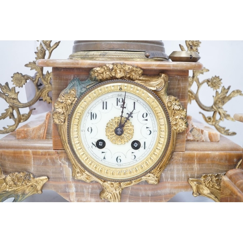 1417 - A French onyx and spelter figural clock garniture 66cm