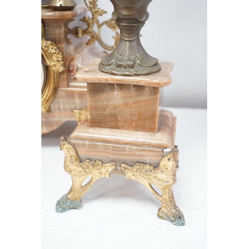 1417 - A French onyx and spelter figural clock garniture 66cm