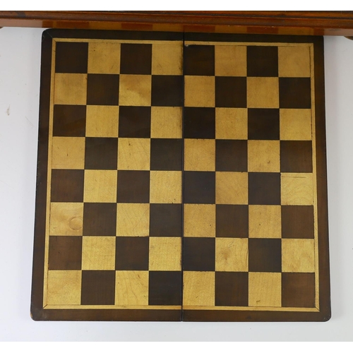 1422 - A late 19th century gilt metal mounted walnut games cabinet,with two panelled doors enclosing slidin... 