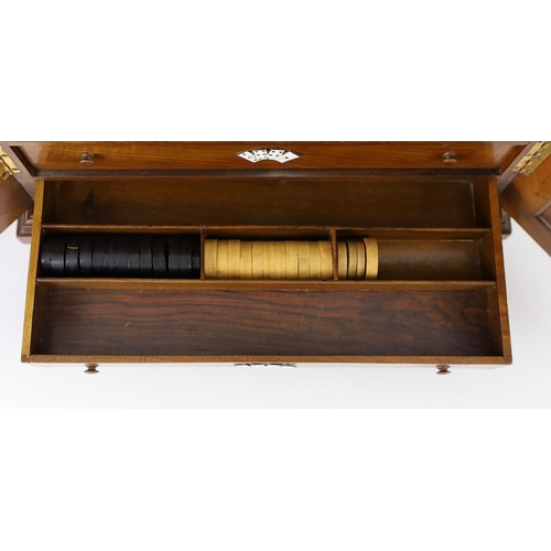 1422 - A late 19th century gilt metal mounted walnut games cabinet,with two panelled doors enclosing slidin... 