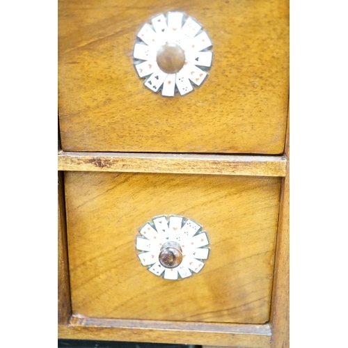 1422 - A late 19th century gilt metal mounted walnut games cabinet,with two panelled doors enclosing slidin... 