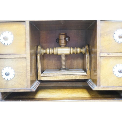 1422 - A late 19th century gilt metal mounted walnut games cabinet,with two panelled doors enclosing slidin... 