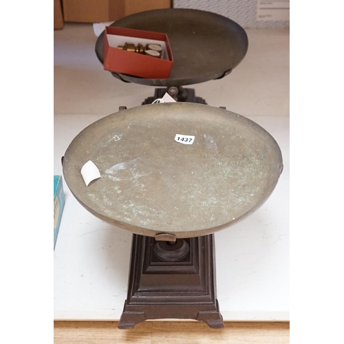 1557 - A large French cast iron and brass weighing scale,82 cms wide.