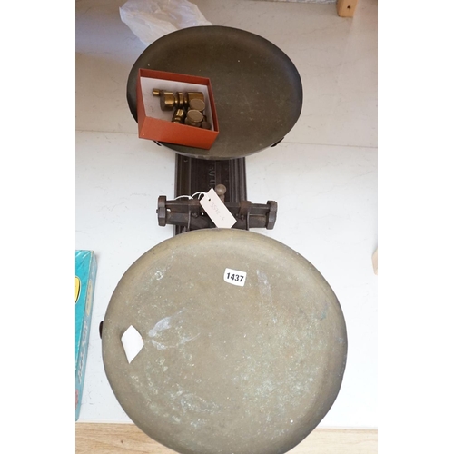 1557 - A large French cast iron and brass weighing scale,82 cms wide.