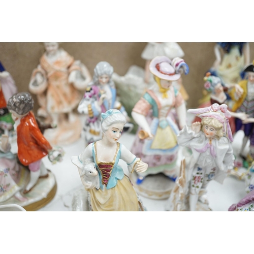 1561 - A large collection of small to medium German, French and English porcelain figurines and groups, tal... 
