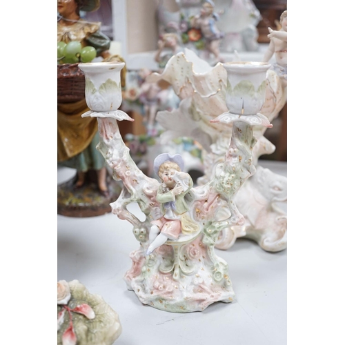 1566 - A group of Continental porcelain and pottery figural vases and centrepieces and two candelabra... 