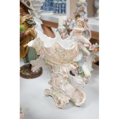 1566 - A group of Continental porcelain and pottery figural vases and centrepieces and two candelabra... 