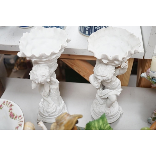 1566 - A group of Continental porcelain and pottery figural vases and centrepieces and two candelabra... 