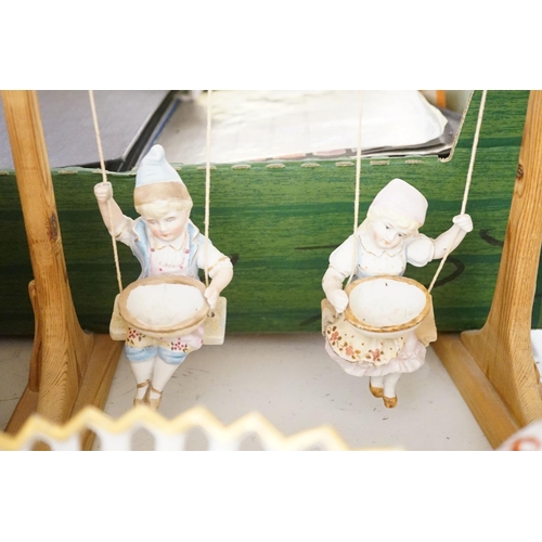 1569 - A pair of bisque swinging figures, Royal Worcester cabinet cup and saucer and five other items... 