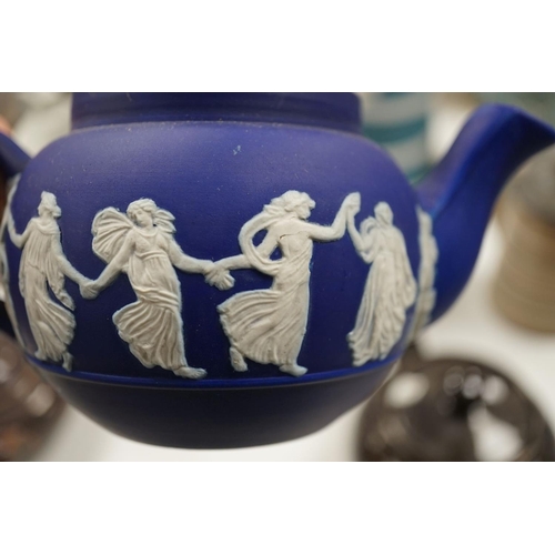 1576 - A collection of Dudson stoneware, including jugs, teapots, cream jugs etc, many decorated in low rel... 