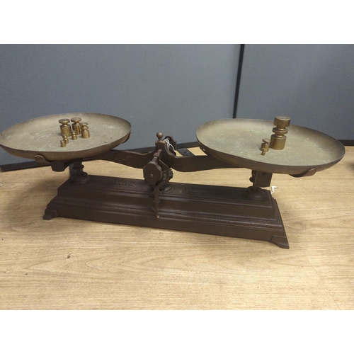 1557 - A large French cast iron and brass weighing scale,82 cms wide.