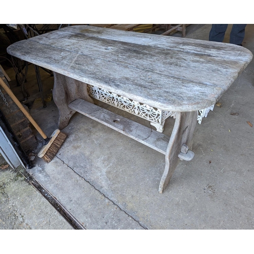 1001 - A rectangular weathered teak garden table, length 120cm, depth 62cm, height 65cm