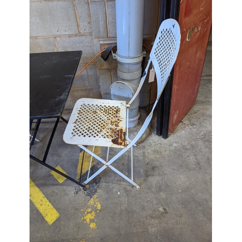 1010 - A square metal folding bistro table, width 60cm, height 71cm, together with two metal chairs... 