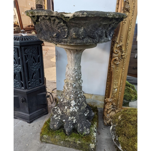 1013 - A circular reconstituted stone bird bath, diameter 56cm, height 89cm