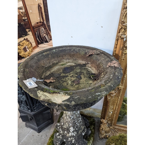 1013 - A circular reconstituted stone bird bath, diameter 56cm, height 89cm