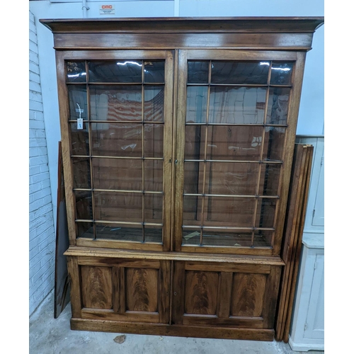 1019 - A George III style mahogany library bookcase, width 154cm, depth 38cm, height 217cm