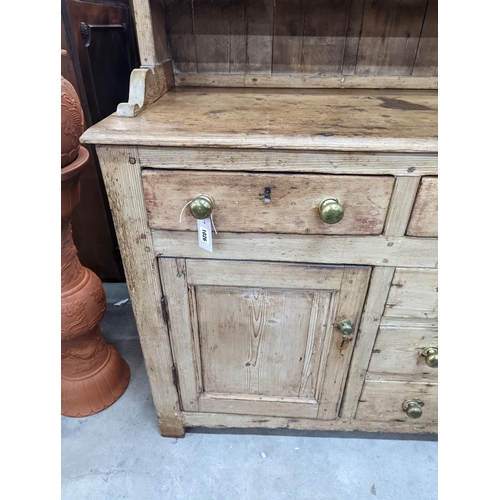 1026 - An early 19th century pine dresser with boarded rack, width 141cm, depth 49cm, height 206cm... 