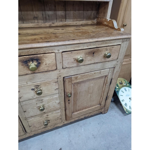 1026 - An early 19th century pine dresser with boarded rack, width 141cm, depth 49cm, height 206cm... 