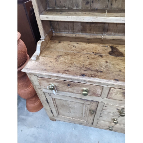 1026 - An early 19th century pine dresser with boarded rack, width 141cm, depth 49cm, height 206cm... 