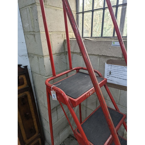 1037 - A set of red painted metal steps, height 188cm