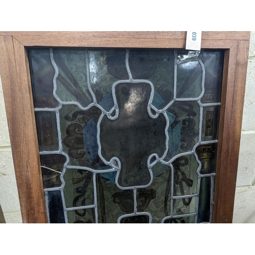 1039 - A rectangular stained glass panel, width 56cm, height 99cm including frame