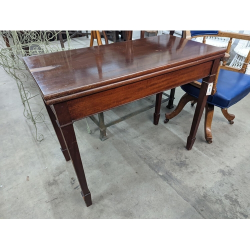 1042 - An Edwardian rectangular mahogany folding tea table, width 92cm, depth 46cm, height 75cm... 