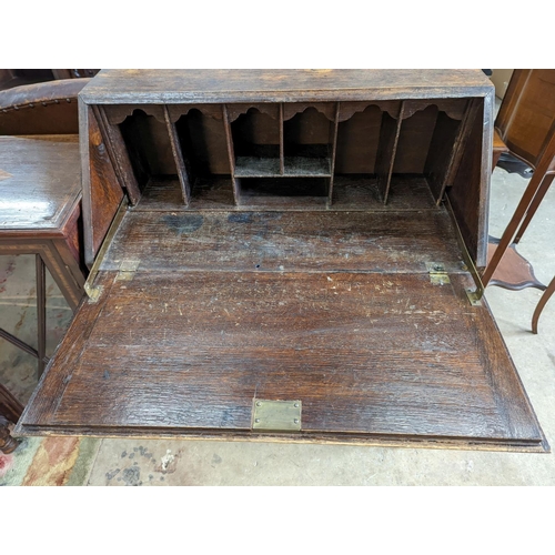 1048 - An early 20th century oak bureau, width 73cm, depth 41cm, height 99cm