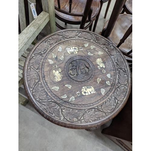 1055 - An Indian bone inlaid circular carved hardwood occasional table, diameter 52cm, height 59cm... 