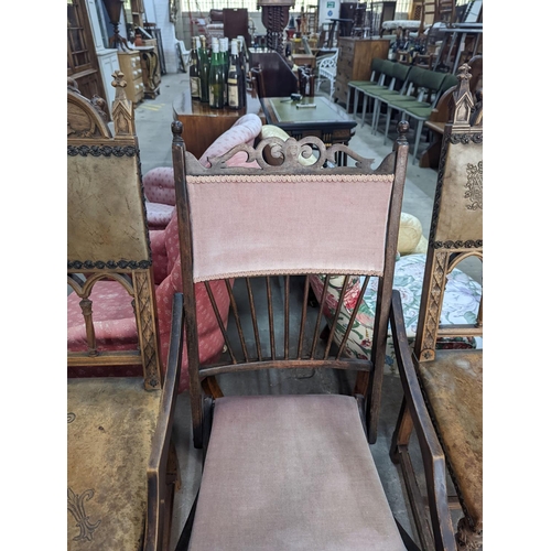 1059 - A pair of Gothic style carved walnut and leather side chairs together with an Edwardian beech foldin... 