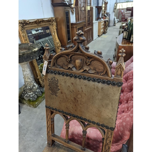 1059 - A pair of Gothic style carved walnut and leather side chairs together with an Edwardian beech foldin... 