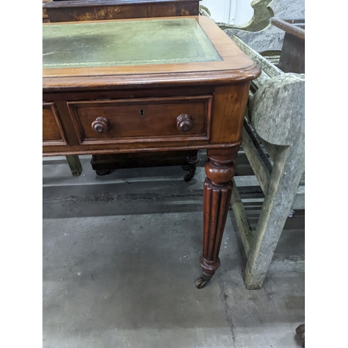 1066 - A Victorian mahogany three drawer writing table on fluted legs, width 106cm, depth 66cm, height 75cm... 