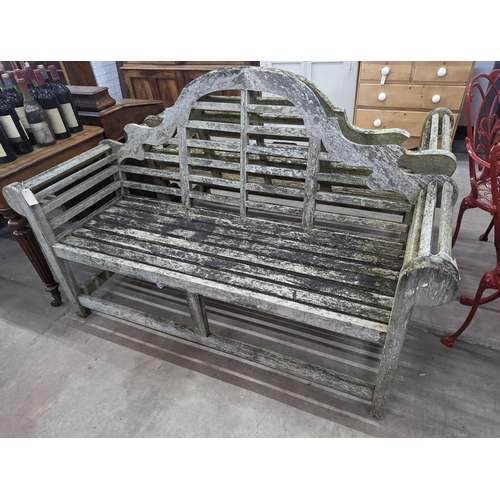 1068 - A pair of Lutyens design weathered teak garden benches, length 167cm, depth 58cm, height 104cm... 