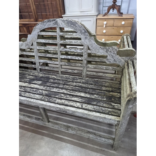 1068 - A pair of Lutyens design weathered teak garden benches, length 167cm, depth 58cm, height 104cm... 