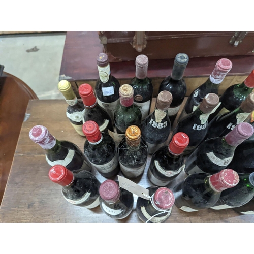 1073 - Twenty three bottles of assorted red wine, mainly French together with a bottle of Hungarian Tokaji... 