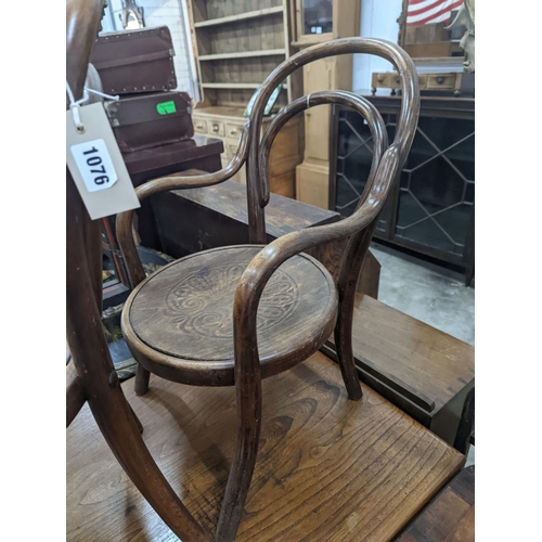 1076 - A near pair of early 20th century beech bentwood childs elbow chairs