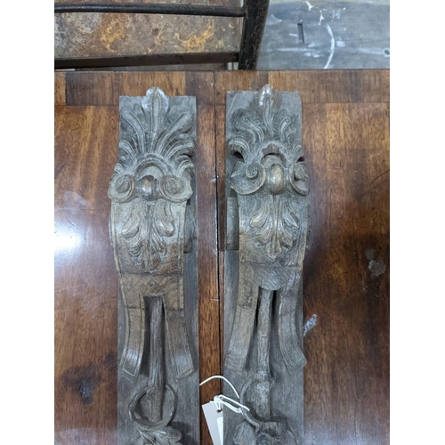 1078 - A pair of 19th century carved oak appliques, height 80cm