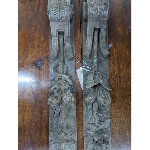 1078 - A pair of 19th century carved oak appliques, height 80cm