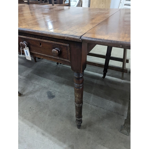 1080 - A Regency rosewood banded mahogany sofa table, 128cm extended, depth 75cm, height 73cm