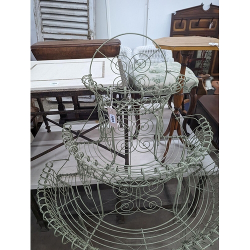 1083 - A Victorian style painted wirework plant stand, width 84cm, depth 54cm, height 130cm