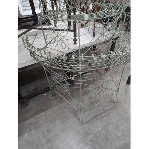 1083 - A Victorian style painted wirework plant stand, width 84cm, depth 54cm, height 130cm