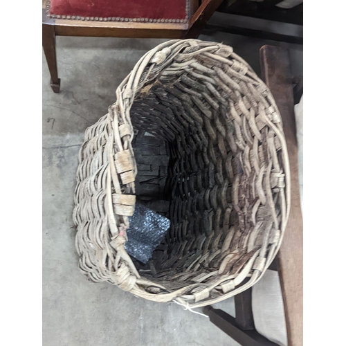 1089 - A vintage woven grape hod, width 48cm, height 64cm