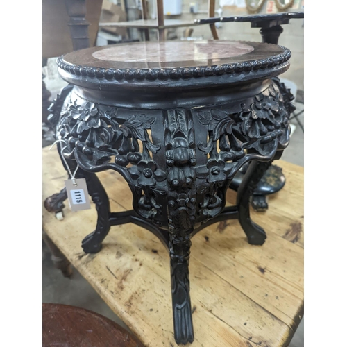 1115 - A 19th century Chinese carved hardwood jardiniere stand, with a rouge marble inset top, diameter 46c... 