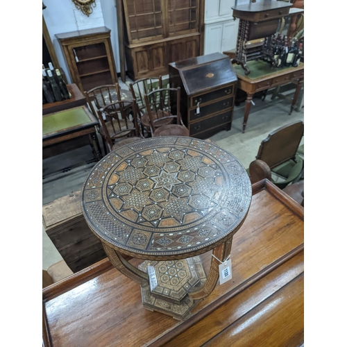 1120 - A Moorish bone and parquetry inlaid two tier occasional table, diameter 41cm, height 52cm... 