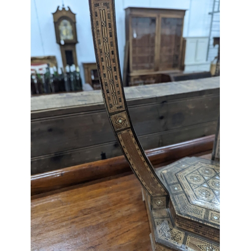 1120 - A Moorish bone and parquetry inlaid two tier occasional table, diameter 41cm, height 52cm... 