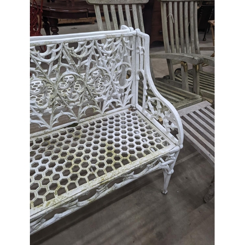 1128 - A pair of Victorian style painted cast metal garden benches, length 138cm, depth 44cm, height  86cm... 