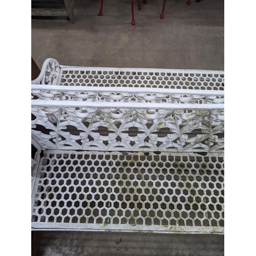 1128 - A pair of Victorian style painted cast metal garden benches, length 138cm, depth 44cm, height  86cm... 