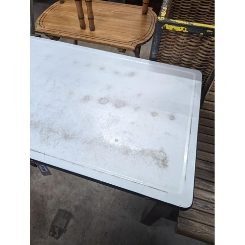 1131 - An enamel top kitchen table, width 105cm, depth 63cm, height 68cm